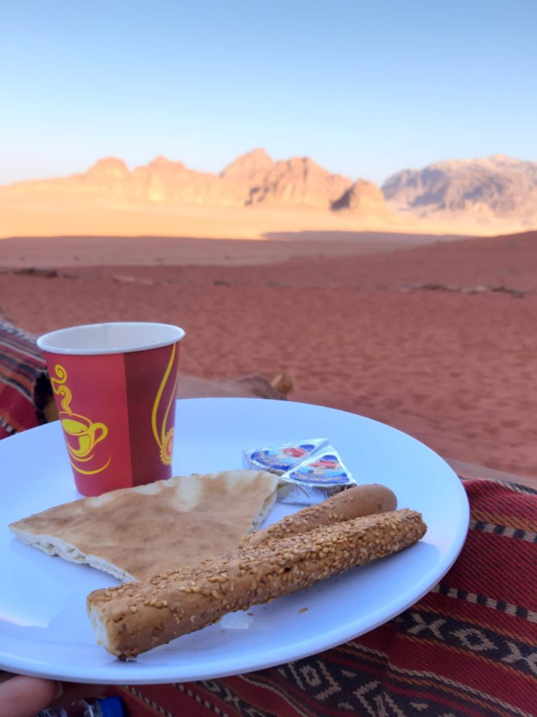 A plate of food wth a view on Wadi Rum
